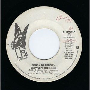 Bobby Braddock Promo Vinyl 45 Between The Lines/The Happy Hour on Elektra VG+